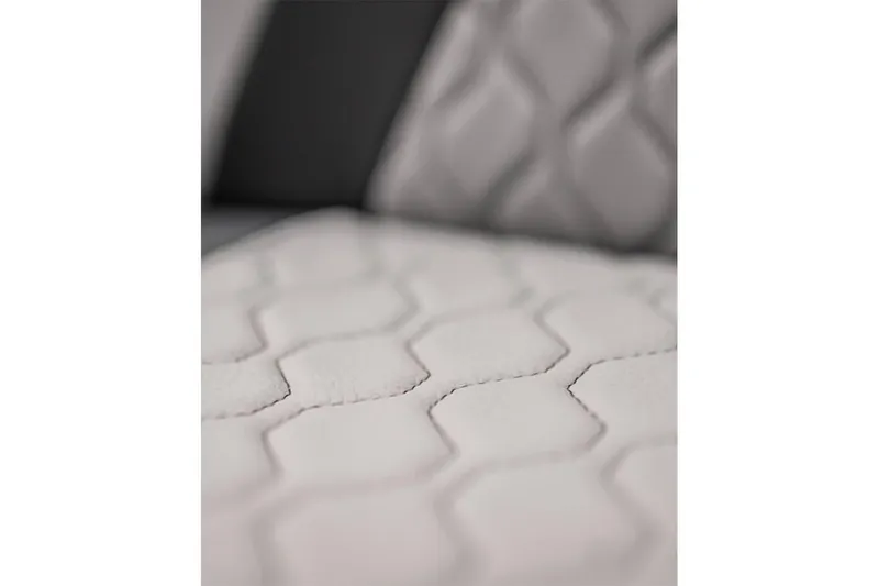 Slide: The Image of Close-up of 2024 Yamaha Boats 222XE seat with hexagonal stitching pattern. - 11