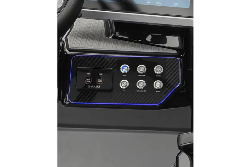 Slide: The Image of 2024 Yamaha Boats 222XE dashboard with control panel and illuminated buttons. - 12