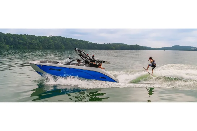 Slide: The Image of 2024 Yamaha Boats 222XE on lake with wakeboarder. - 16