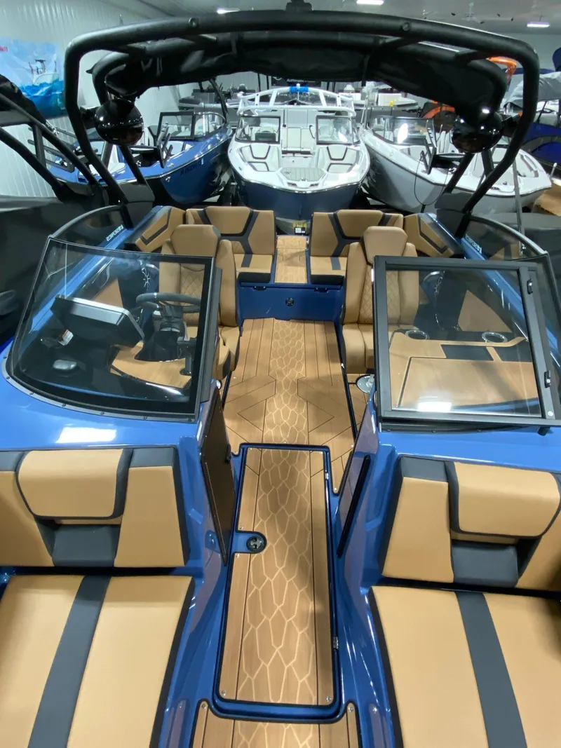 Slide: The Image of 2024 Yamaha Boats 222XE interior with tan and black seating, sleek design. - 5