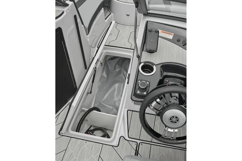 Slide: The Image of 2024 Yamaha Boats 222XE interior with storage compartment and steering wheel. - 8