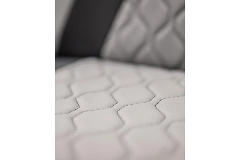 Slide: The Image of Close-up of 2024 Yamaha Boats 252S seat with hexagonal stitching pattern. - 11