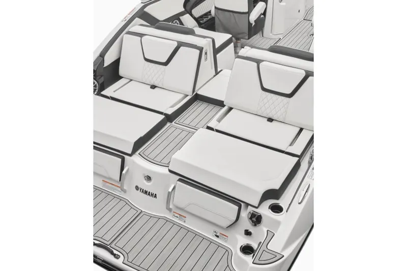 Slide: The Image of 2024 Yamaha Boats 252S interior with white cushioned seating and sleek design. - 12