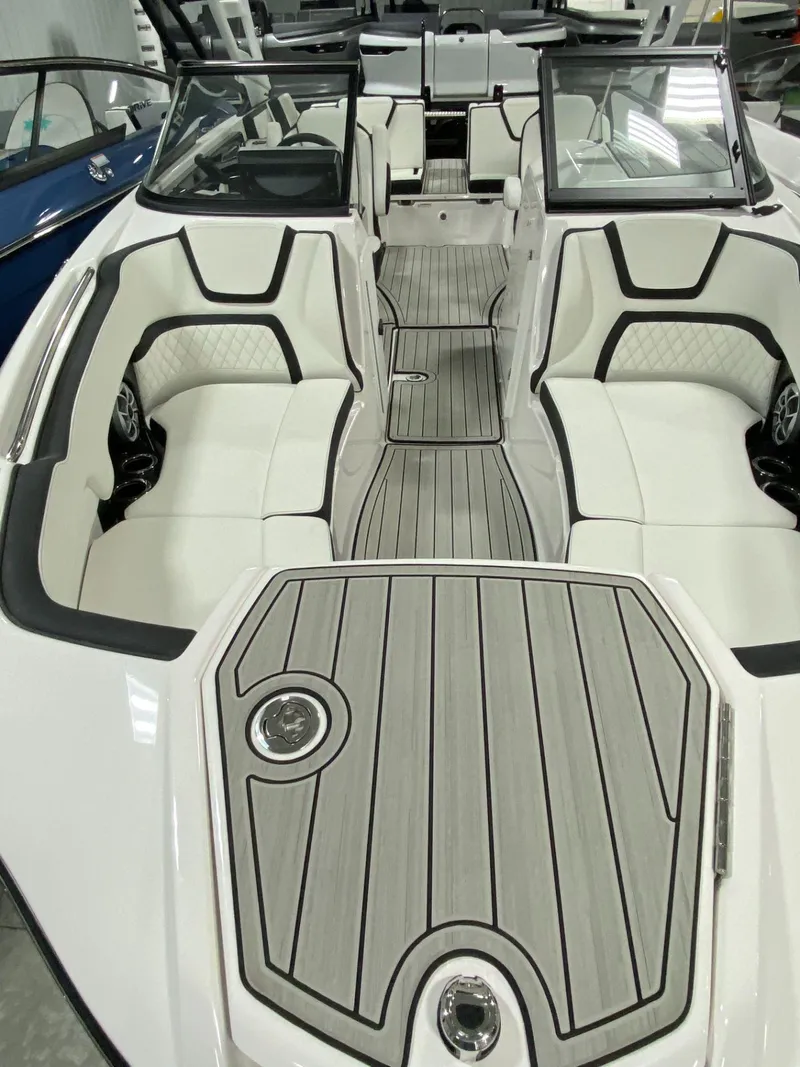 Slide: The Image of 2024 Yamaha Boats 252S interior with sleek white seating and modern design. - 5
