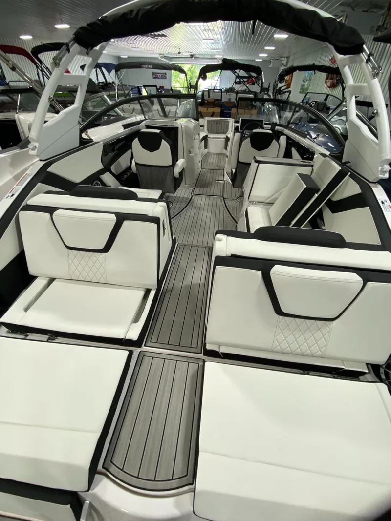Slide: The Image of 2024 Yamaha Boats 252S interior with sleek white seating and modern design. - 6