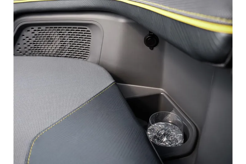 Slide: The Image of 2024 Manitou Explore 24 Navigator interior with cup holder and speaker detail. - 21