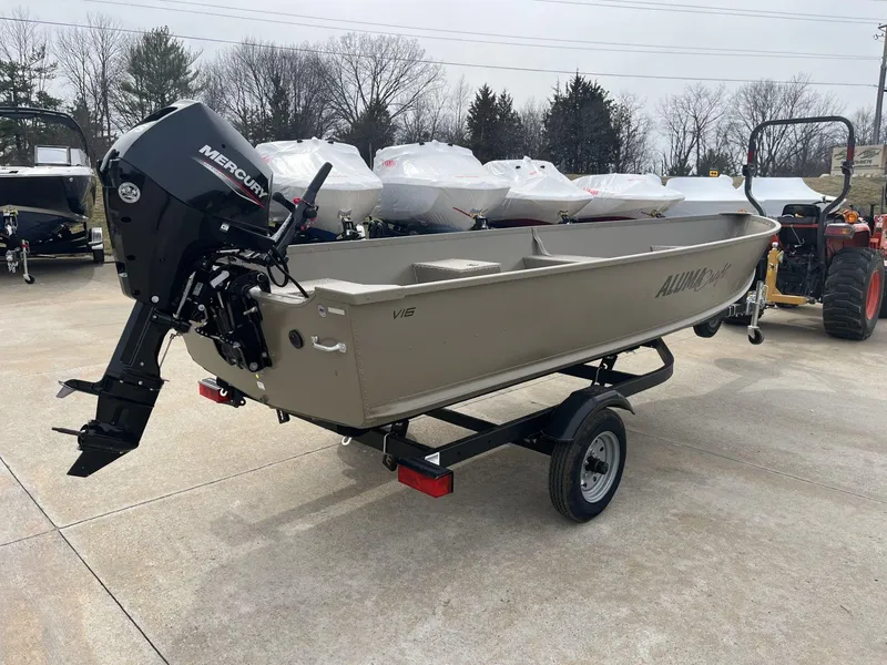 Slide: The Image of 2024 Alumacraft V-16 Tiller boat with Mercury engine on trailer, outdoor display. - 6
