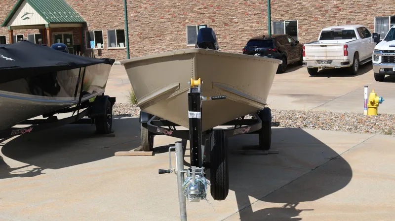 Slide: The Image of 2024 Alumacraft V-16 Tiller boat on trailer in parking lot. - 9