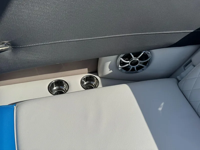 Slide: The Image of 2024 Crownline 220SS boat interior with cup holders and speaker detail. - 12