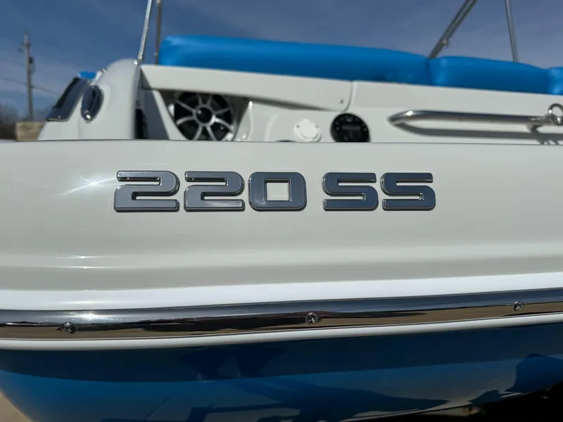 Slide: The Image of Close-up of 2024 Crownline 220SS boat model name on hull. - 3