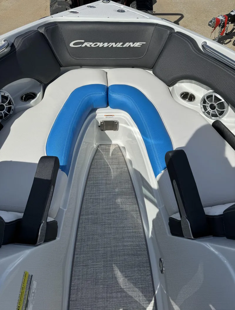 Slide: The Image of 2024 Crownline 220SS boat interior with blue and gray seating. - 4