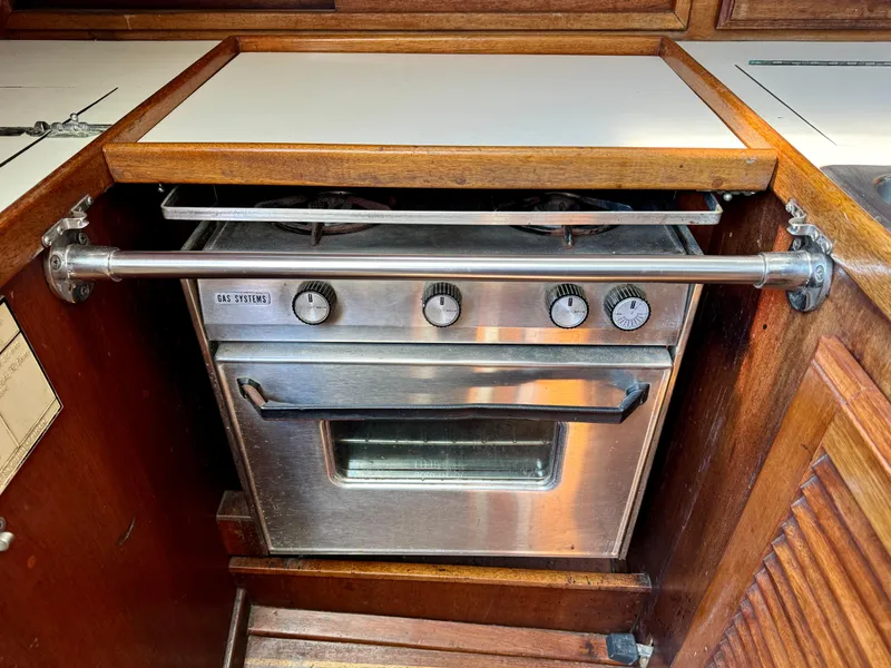 Slide: The Image of Stainless steel oven in 1979 Islander IP Peterson 40 yacht kitchen. - 17