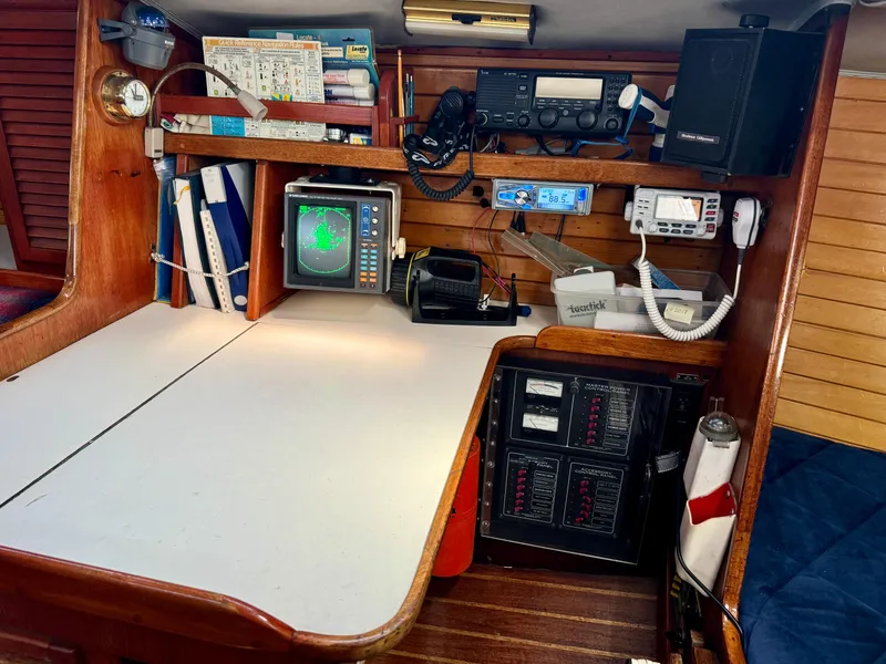 Slide: The Image of Navigation station on 1979 Islander IP Peterson 40 sailboat with radar and communication equipment. - 27