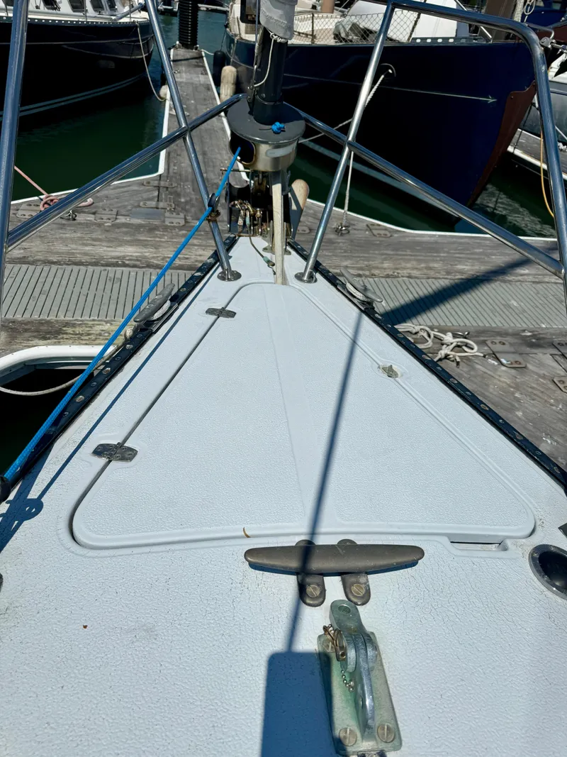 Slide: The Image of Bow of 1979 Islander IP Peterson 40 sailboat docked at marina. - 33