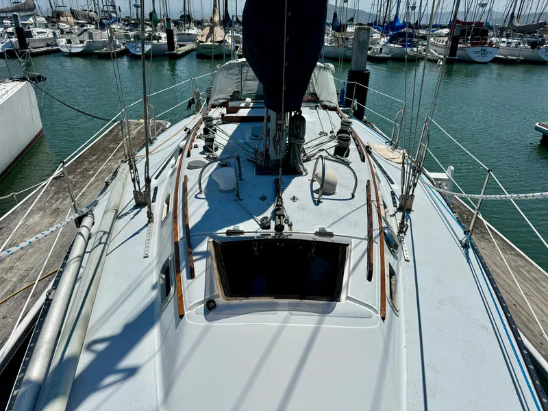 Slide: The Image of 1979 Islander IP Peterson 40 sailboat docked at marina, view of deck and rigging. - 35
