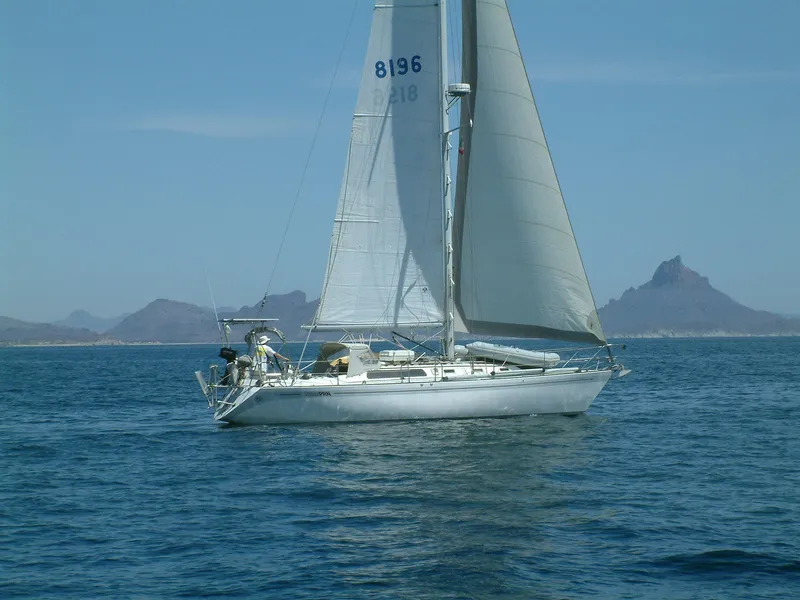 Slide: The Image of Sailing yacht Islander IP Peterson 40, 1979, on calm sea with mountainous background. - 4