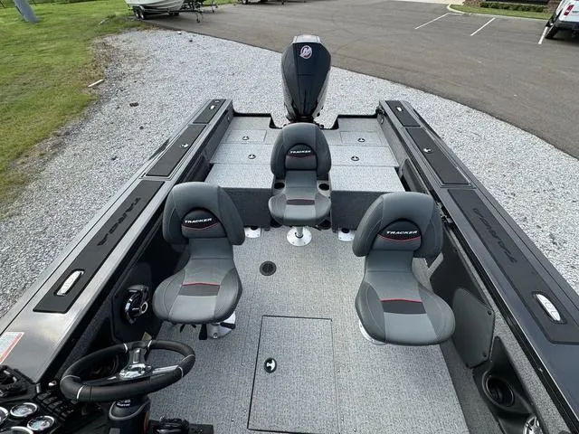 Slide: The Image of 2023 Tracker V-19 WT Targa boat interior with three seats and steering wheel. - 11