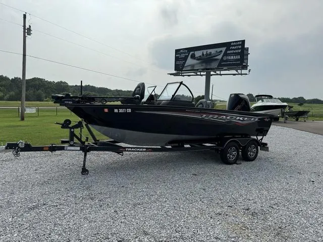 Slide: The Image of 2023 Tracker V-19 WT TARGA boat on trailer in outdoor setting. - 4