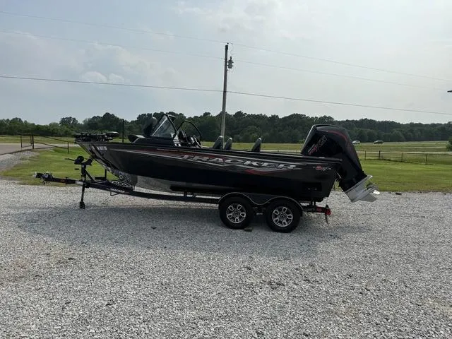 Slide: The Image of 2023 Tracker V-19 WT TARGA boat on trailer in outdoor setting. - 5