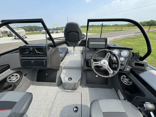 Slide: The Image of 2023 Tracker V-19 WT TARGA boat interior with steering wheel and dashboard controls. - 8
