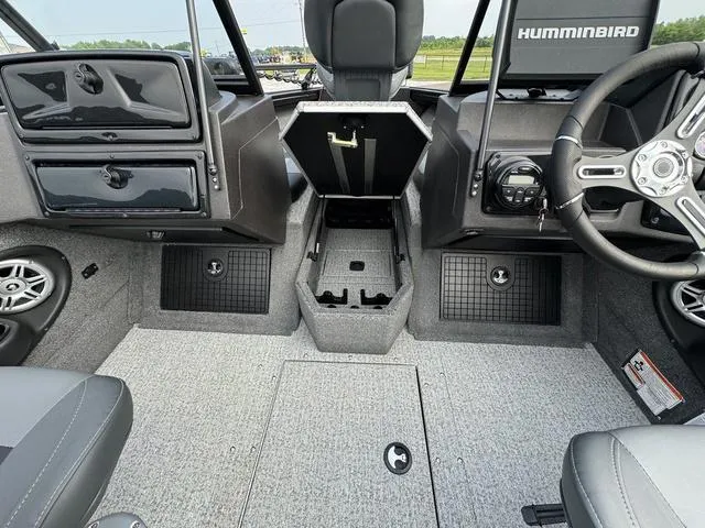 Slide: The Image of Interior of 2023 Tracker V-19 WT TARGA boat with steering wheel and storage compartments. - 9