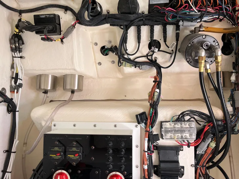 Slide: The Image of Wiring and controls inside a 2022 Aquasport 2300 Center Console boat. - 34