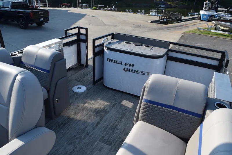 Slide: The Image of 2025 Angler Qwest 8524 ALL SPORT boat interior with seating and storage. - 10