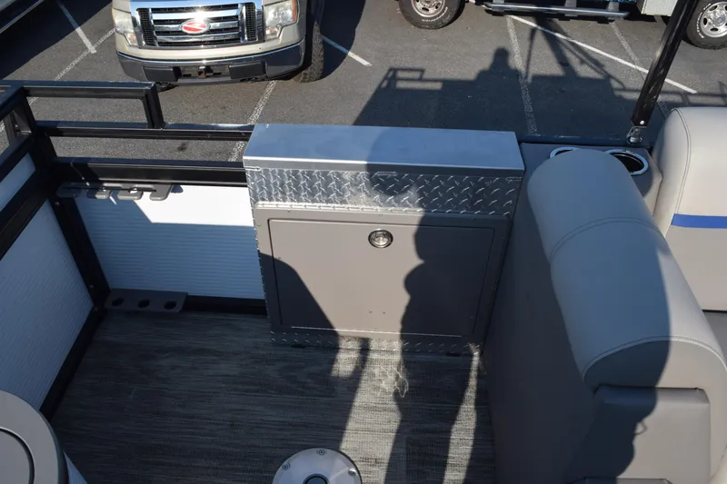 Slide: The Image of 2025 Angler Qwest 8524 ALL SPORT boat interior with seating and storage compartment. - 14