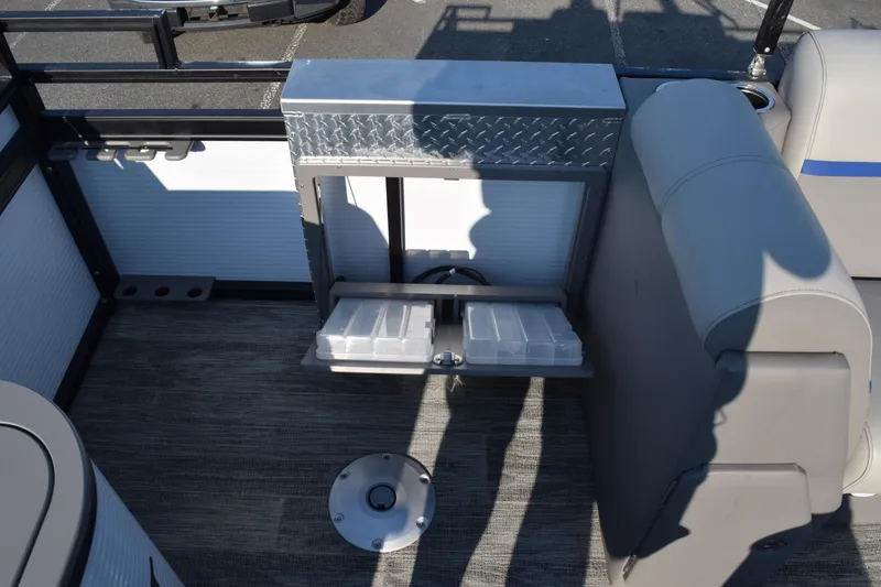 Slide: The Image of 2025 Angler Qwest 8524 ALL SPORT boat interior with storage compartments and seating. - 15
