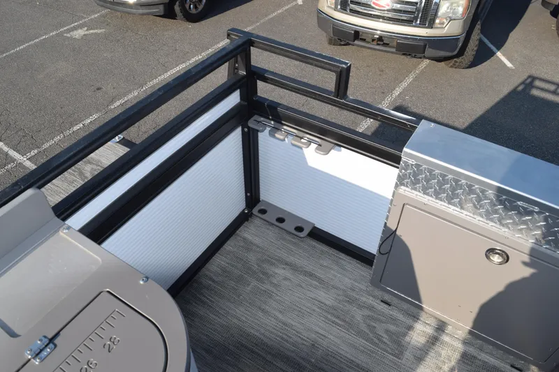 Slide: The Image of 2025 Angler Qwest 8524 ALL SPORT boat interior with storage and seating area. - 16