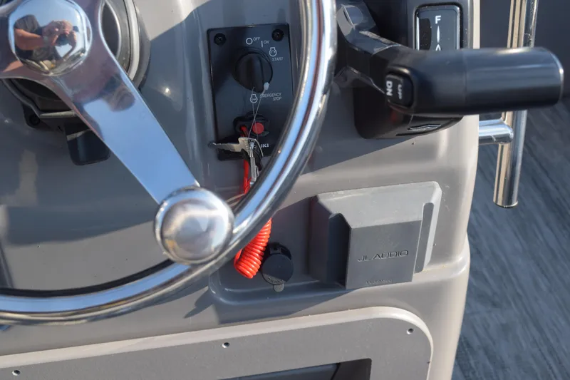 Slide: The Image of Close-up of 2025 Angler Qwest 8524 ALL SPORT boat dashboard with steering wheel and controls. - 20