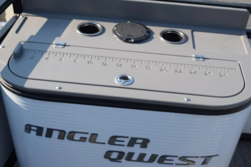 Slide: The Image of 2025 Angler Qwest 8524 ALL SPORT boat with measurement ruler and storage compartments. - 21