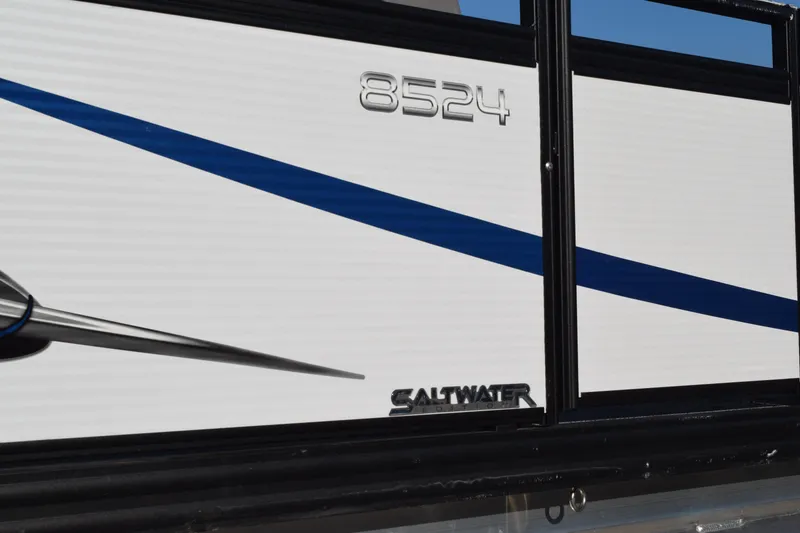 Slide: The Image of 2025 Angler Qwest 8524 ALL SPORT boat with blue stripe and saltwater label. - 7