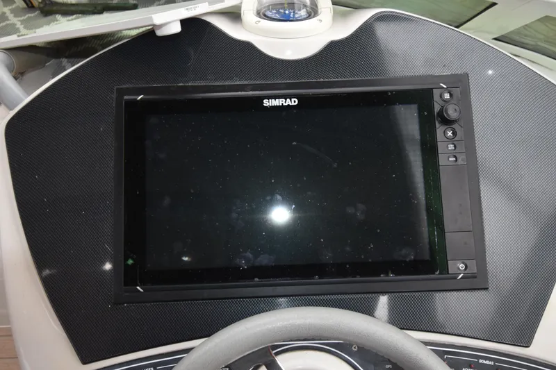 Slide: The Image of Simrad navigation display on 2018 Pronautica 34 boat dashboard. - 11