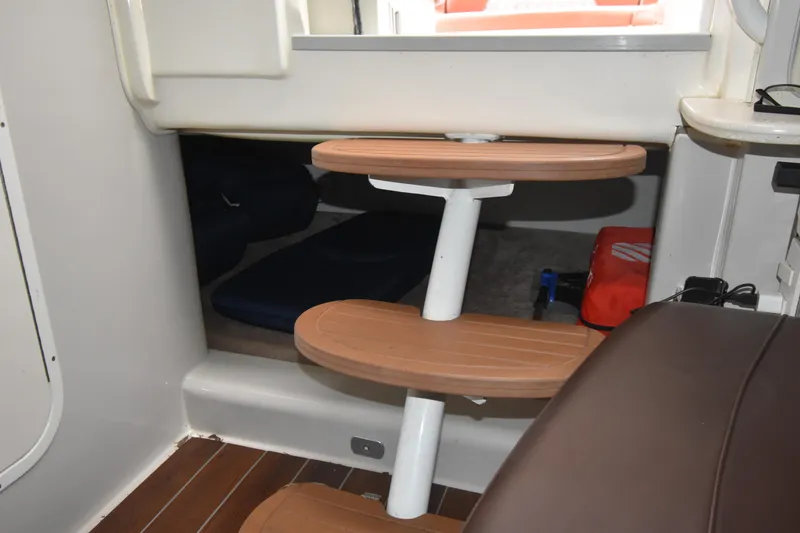 Slide: The Image of Interior of 2018 Pronautica 34 boat with wooden steps and storage area. - 14
