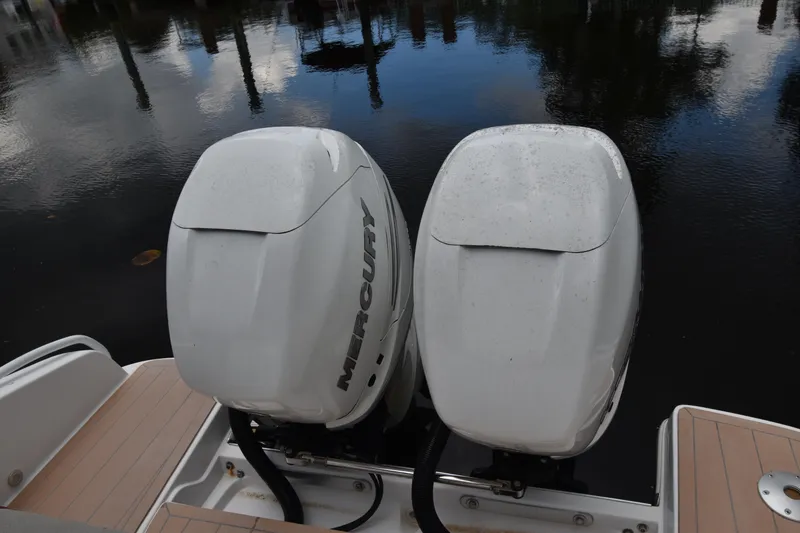 Slide: The Image of 2018 Pronautica 34 with dual Mercury outboard engines on calm water. - 18