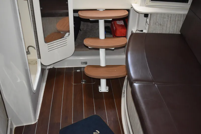 Slide: The Image of Interior of 2018 Pronautica 34 boat with wooden steps and leather seating. - 24