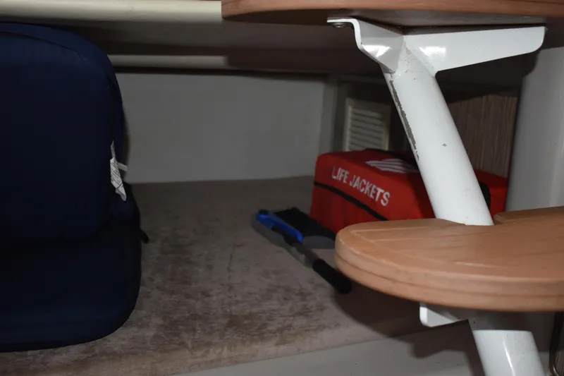 Slide: The Image of Interior of 2018 Pronautica 34 boat with life jackets and storage space. - 26