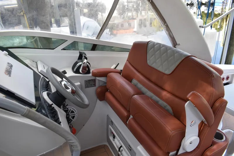 Slide: The Image of Luxurious 2018 Pronautica 34 boat interior with leather seating and modern steering console. - 4