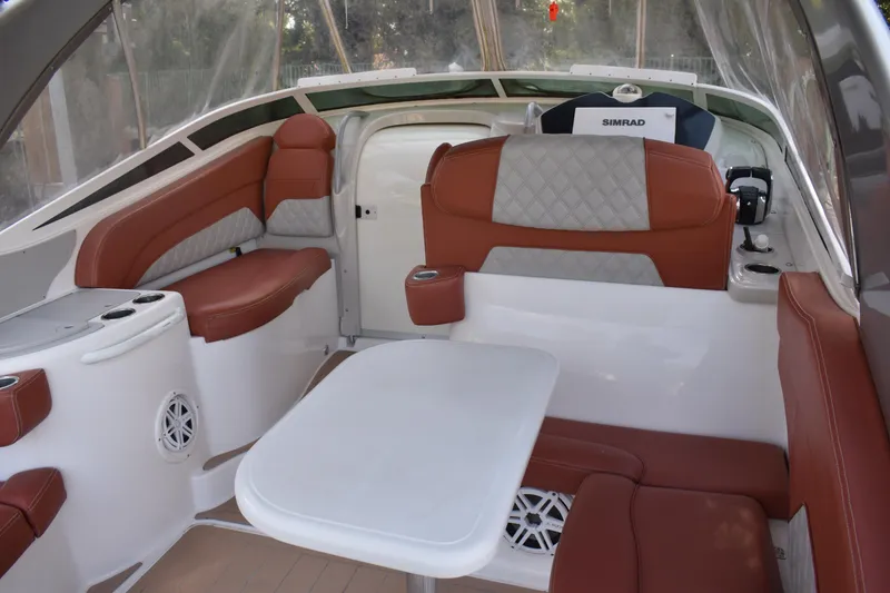 Slide: The Image of Luxurious interior of 2018 Pronautica 34 boat with leather seating and table. - 6