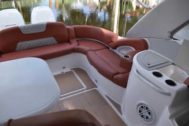 Slide: The Image of Luxurious seating area on 2018 Pronautica 34 boat with red cushions and cup holders. - 9