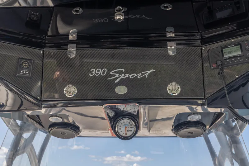 Slide: The Image of Nor-Tech 390 Sport Cuddy Center Console dashboard, 2014 model, featuring sleek design and controls. - 8