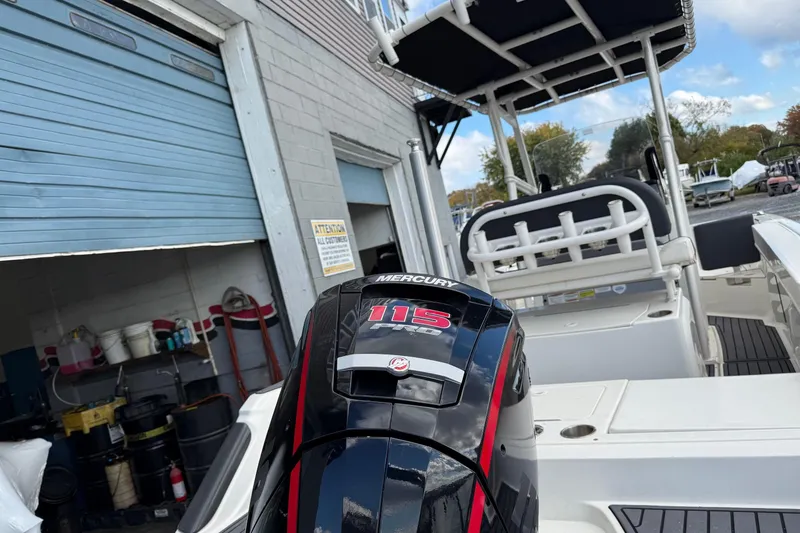Slide: The Image of 2023 Bayliner Trophy T20CC boat with Mercury 115 engine at a marina. - 3