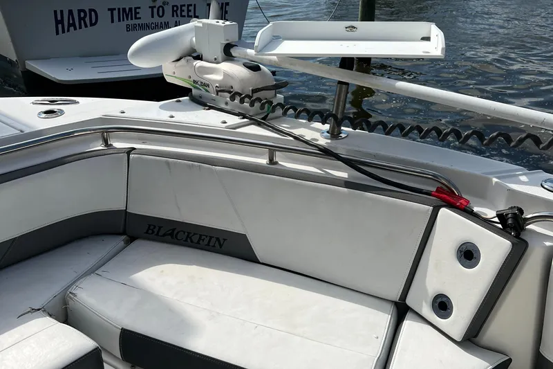 Slide: The Image of 2019 Blackfin 242 CC boat interior with seating and fishing equipment. - 13