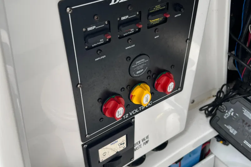 Slide: The Image of Control panel of a 2019 Blackfin 242 CC boat with switches and dials. - 17