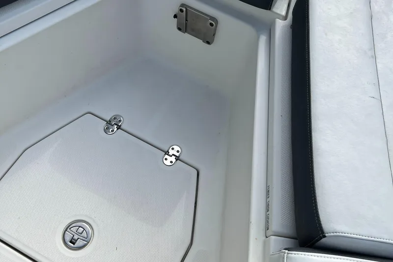 Slide: The Image of 2019 Blackfin 242 CC boat interior with storage compartment and seating. - 18