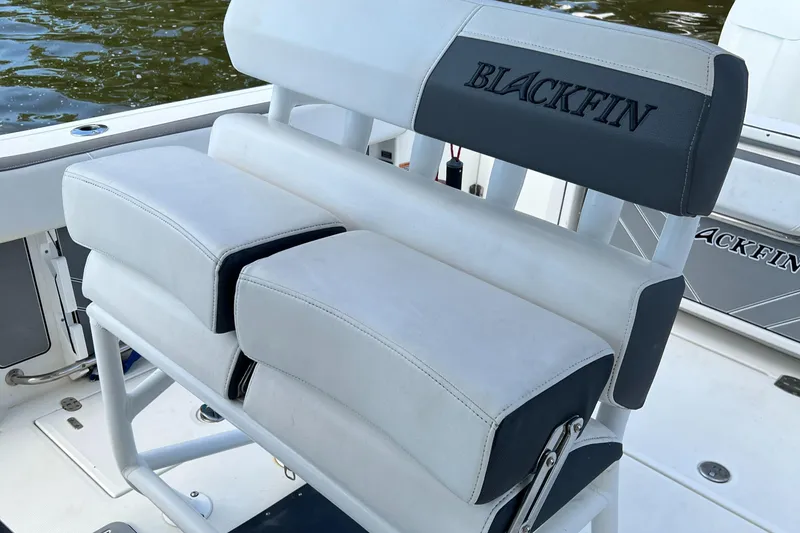 Slide: The Image of 2019 Blackfin 242 CC boat seating with white and black upholstery. - 20