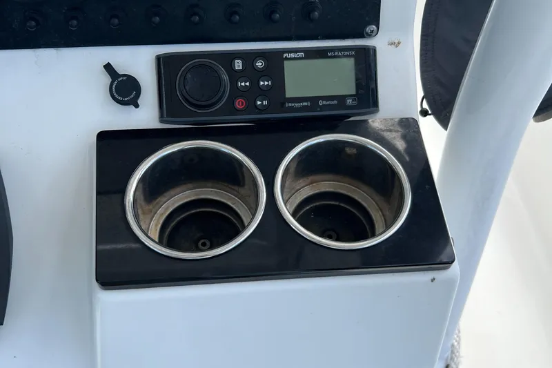 Slide: The Image of Control panel and cup holders on 2019 Blackfin 242 CC boat. - 21