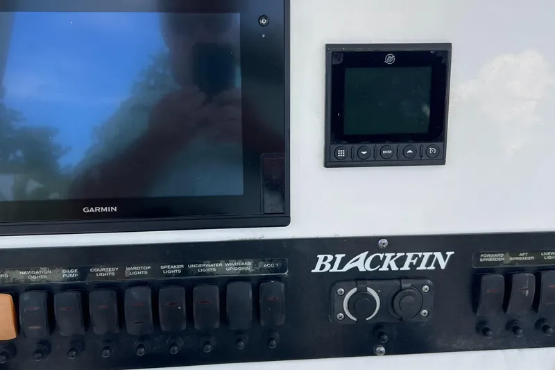 Slide: The Image of Control panel of 2019 Blackfin 242 CC boat with Garmin display. - 23