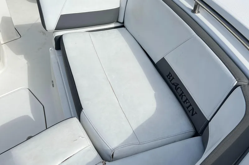 Slide: The Image of 2019 Blackfin 242 CC boat seating with white and gray upholstery. - 6